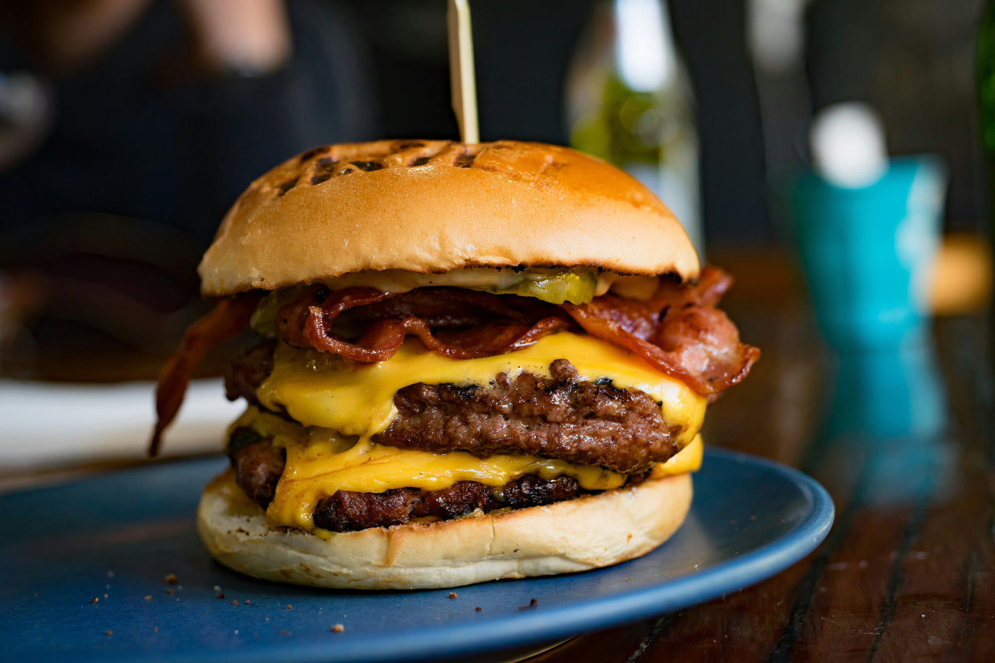 smash burger on a bum with cheese and bacon