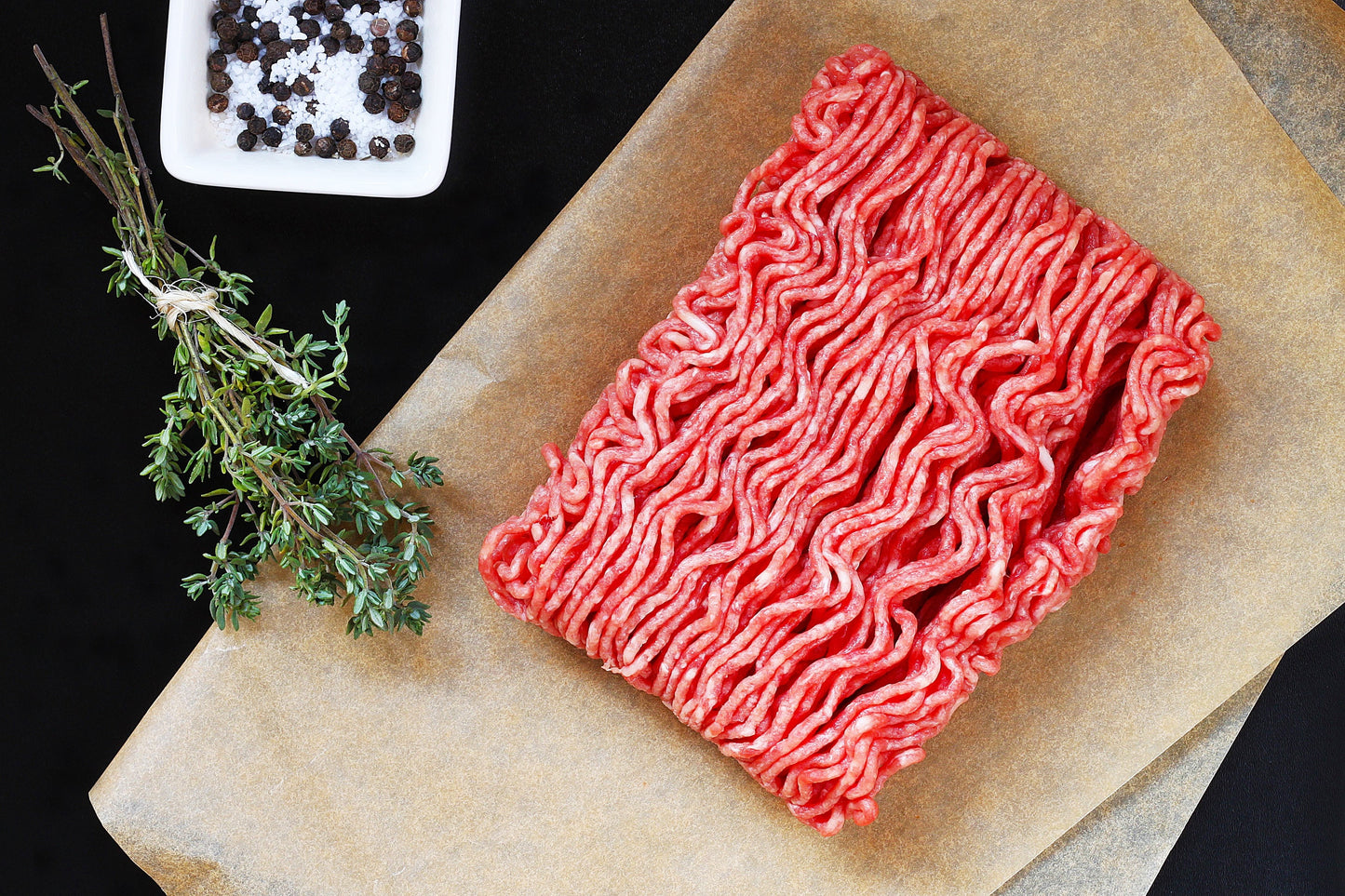 raw smash burger mince on greaseproof paper