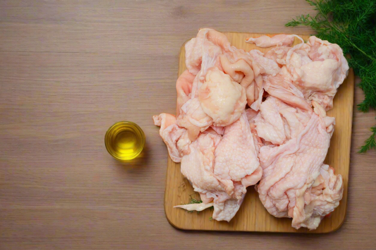 raw chicken skin on a chopping board